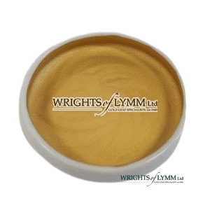 A ceramic pot containing 0.4 gram of 23.5ct shell gold with a yellowish-gold colour