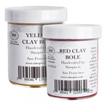 Two containers of Sinopia Clay Bole in red and yellow colors, labeled as 'Yellow Clay Bole' and 'Red Clay Bole', handcrafted by Sinopia in San Francisco.