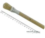 A short, string-bound gesso brush for applying gesso in gilding projects