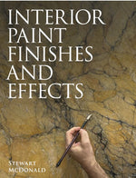 Book cover of 'Interior Paint Finishes and Effects' with a hand holding a paintbrush against a textured wall background.