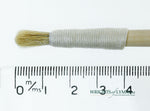 A short, string-bound gesso brush for applying gesso in gilding projects