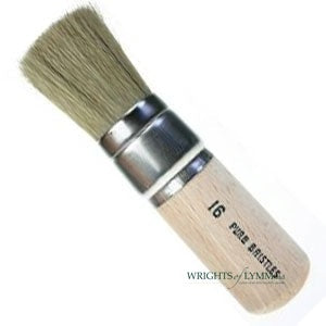 A white bristle stencil brush has short, stiff bristles for controlled paint application, ideal for stenciling and dry brushing techniques.