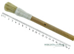 A short, string-bound gesso brush for applying gesso in gilding projects