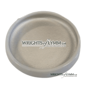 2 grams of Silver shell gold in a ceramic dish