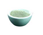Light blue bowl filled with Fuller Earth on a white background